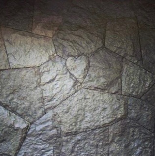Heart carved into flagstone paving