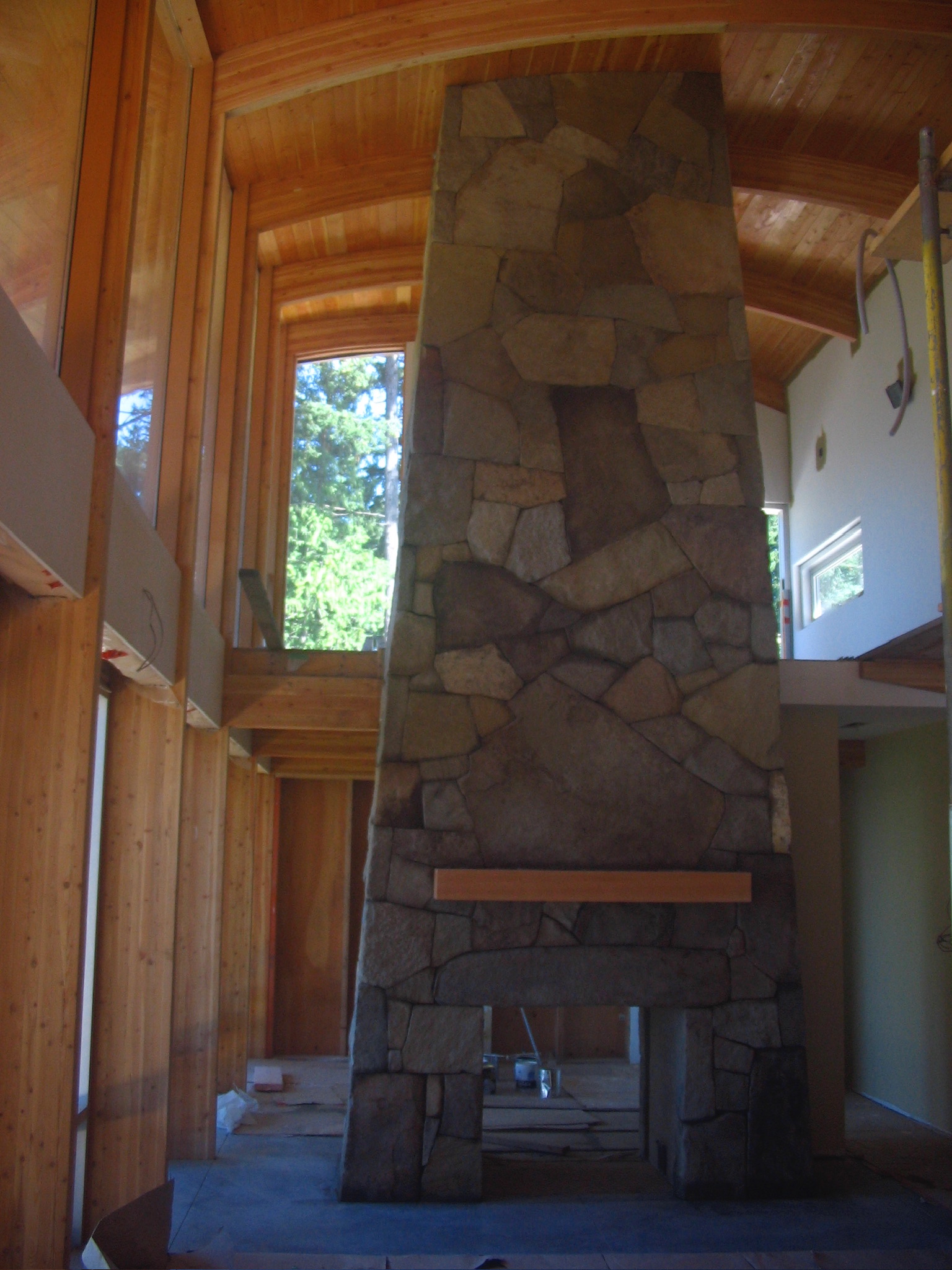 Tall stone fireplace surround
