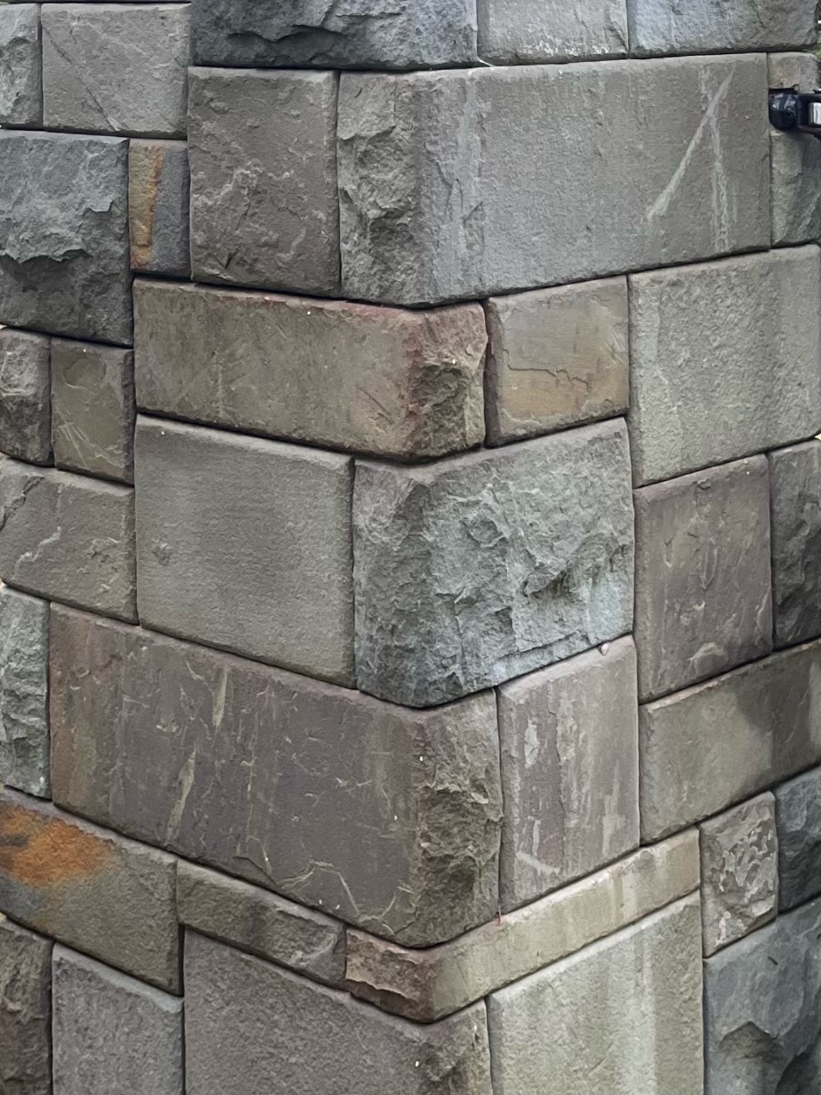 Driveway gate pillar in dry-stack stone