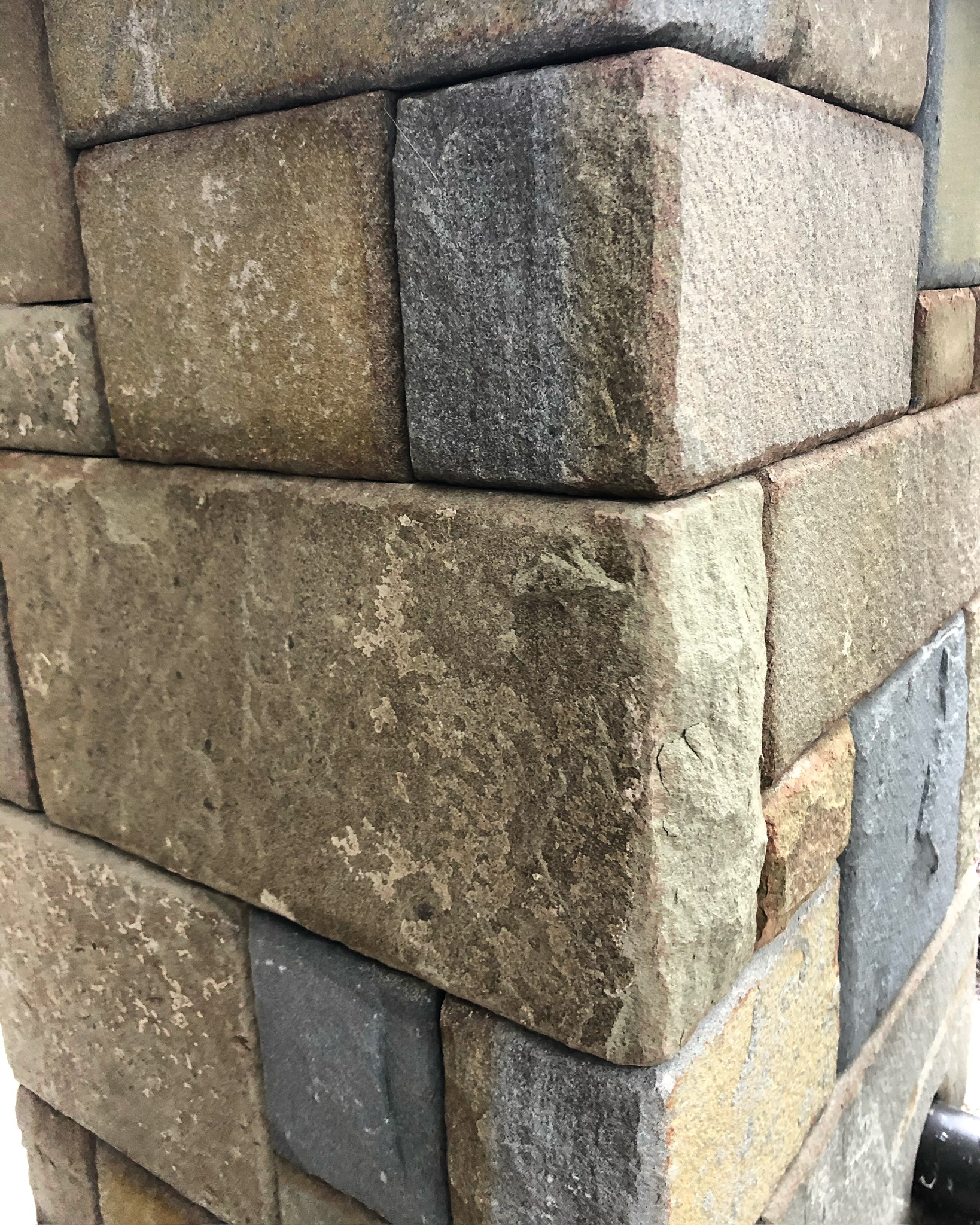 Close-up of a stone-clad post corner detail
